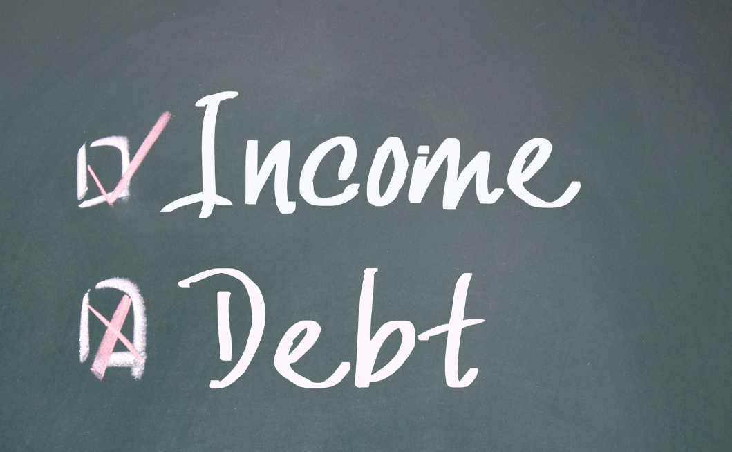 Income & Debt on a chalkboard