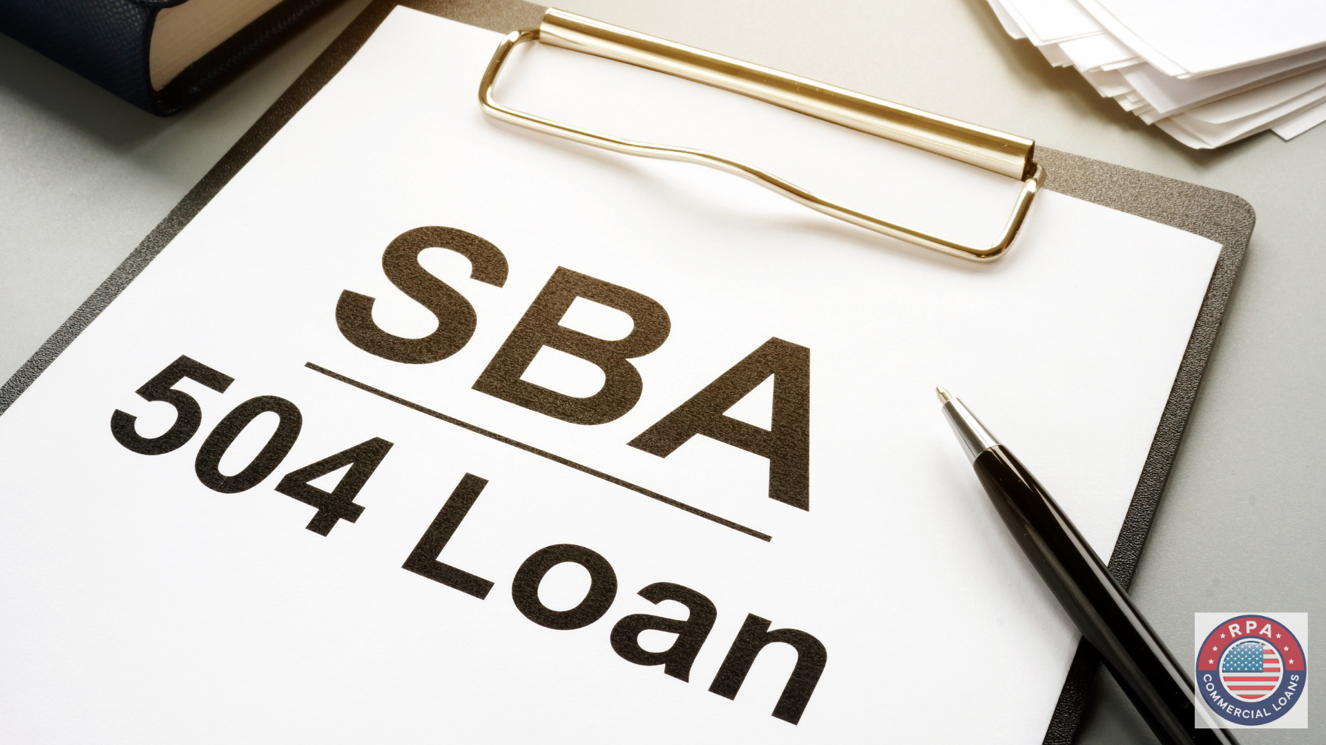 SBA 504 Loan (text) on clipboard